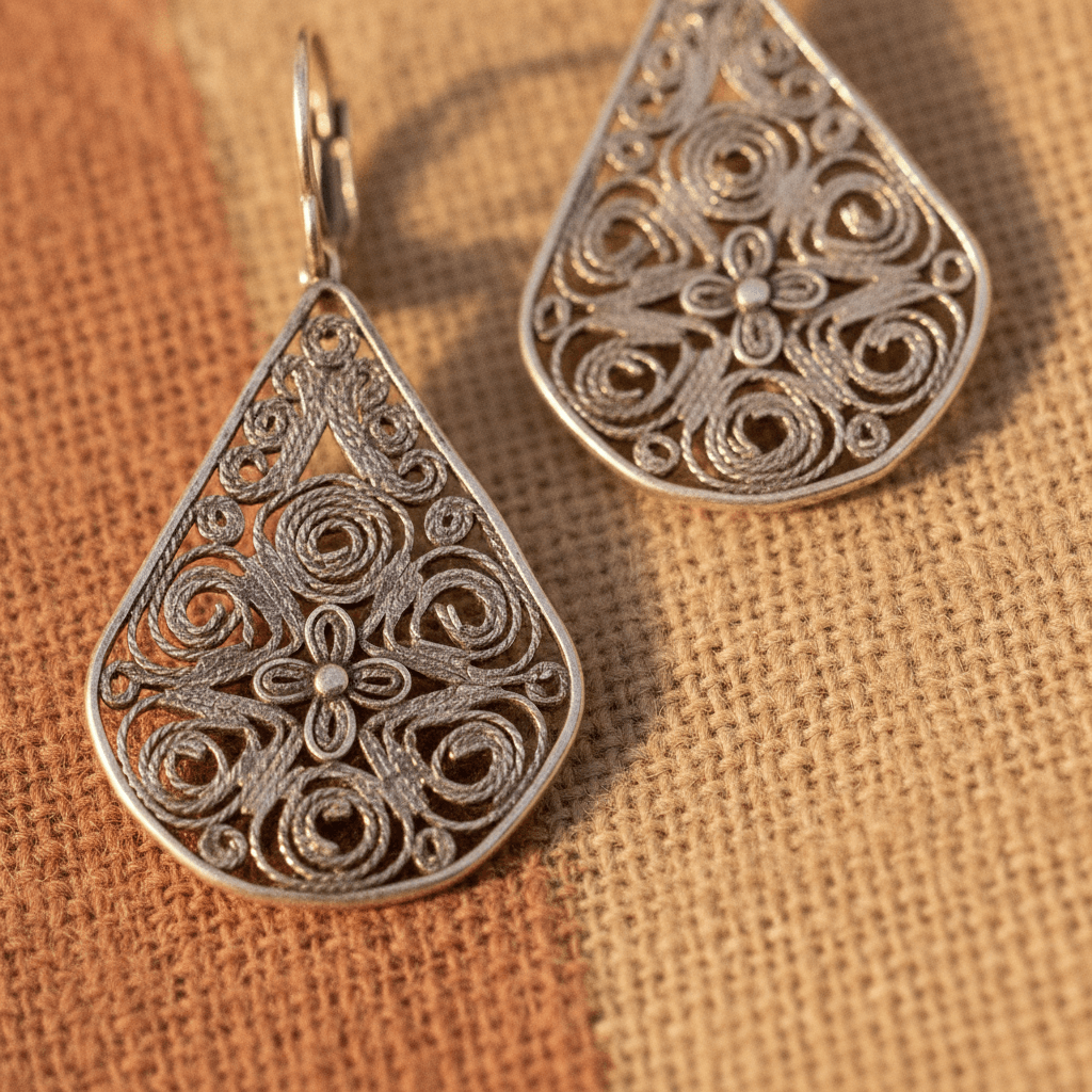 Close-up of elegant Filigree Drop Earrings, showcasing traditional Moroccan silver craftsmanship from Tiznit.
